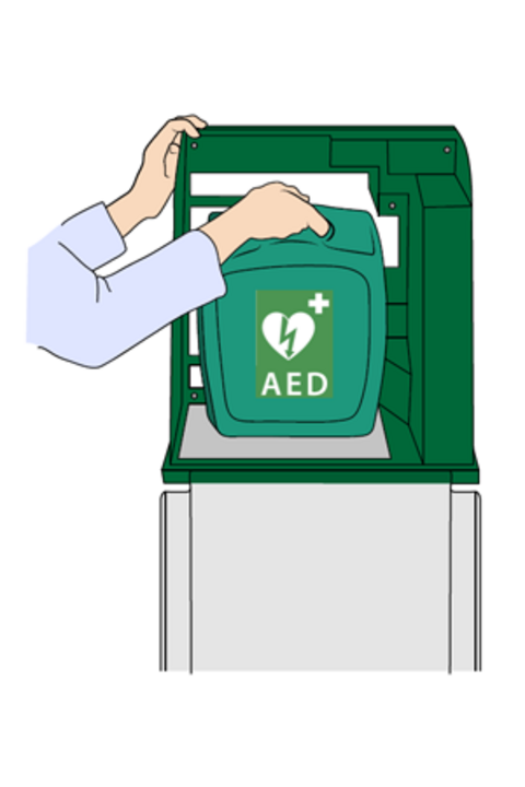 Ein Defibrillator wird aus der Halterung genommen